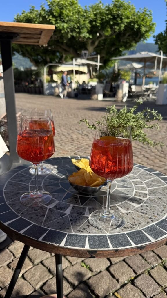 By train to Ticino - a terrace in Ascona - a Campari Spritz