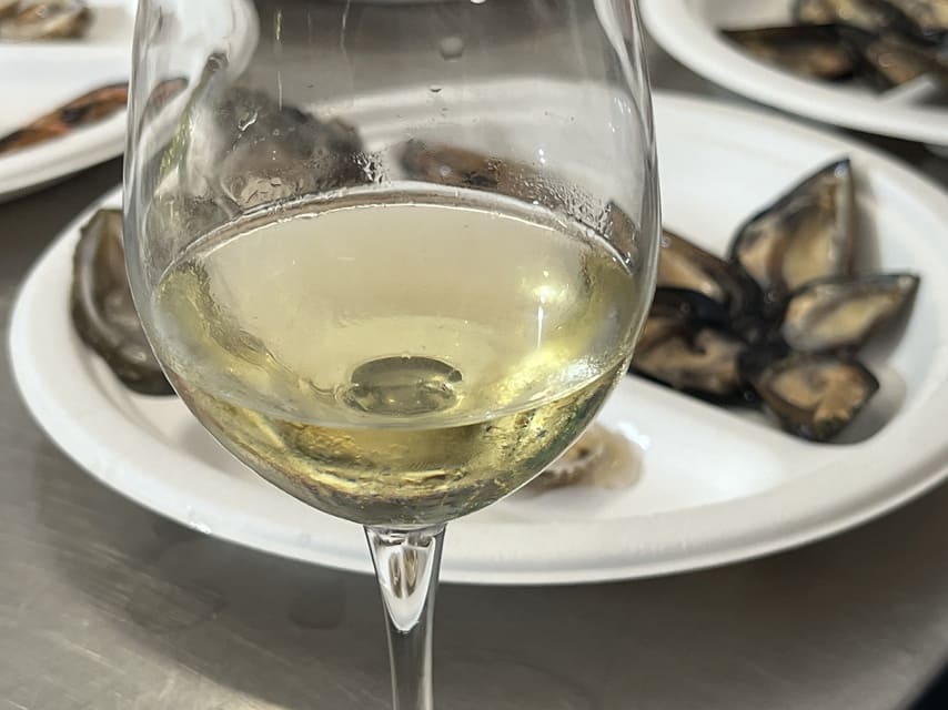 Puglia - a glass of wine with mussels
