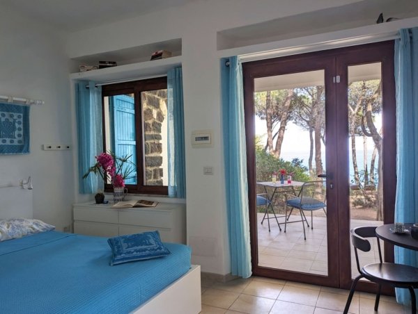 I Liberotti - Sardinie - kamer Ginepro - deur naar tuin